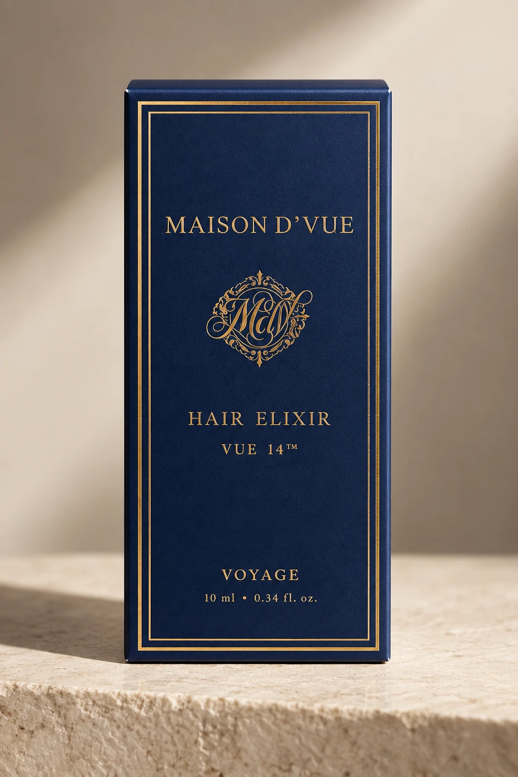 The Voyage carton in navy and gold, Vue 14 Hair Elixir, 10 ml
